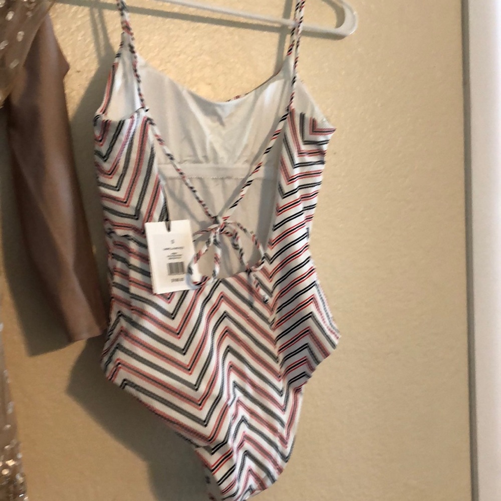 Brand new never worn Gabriella one piece